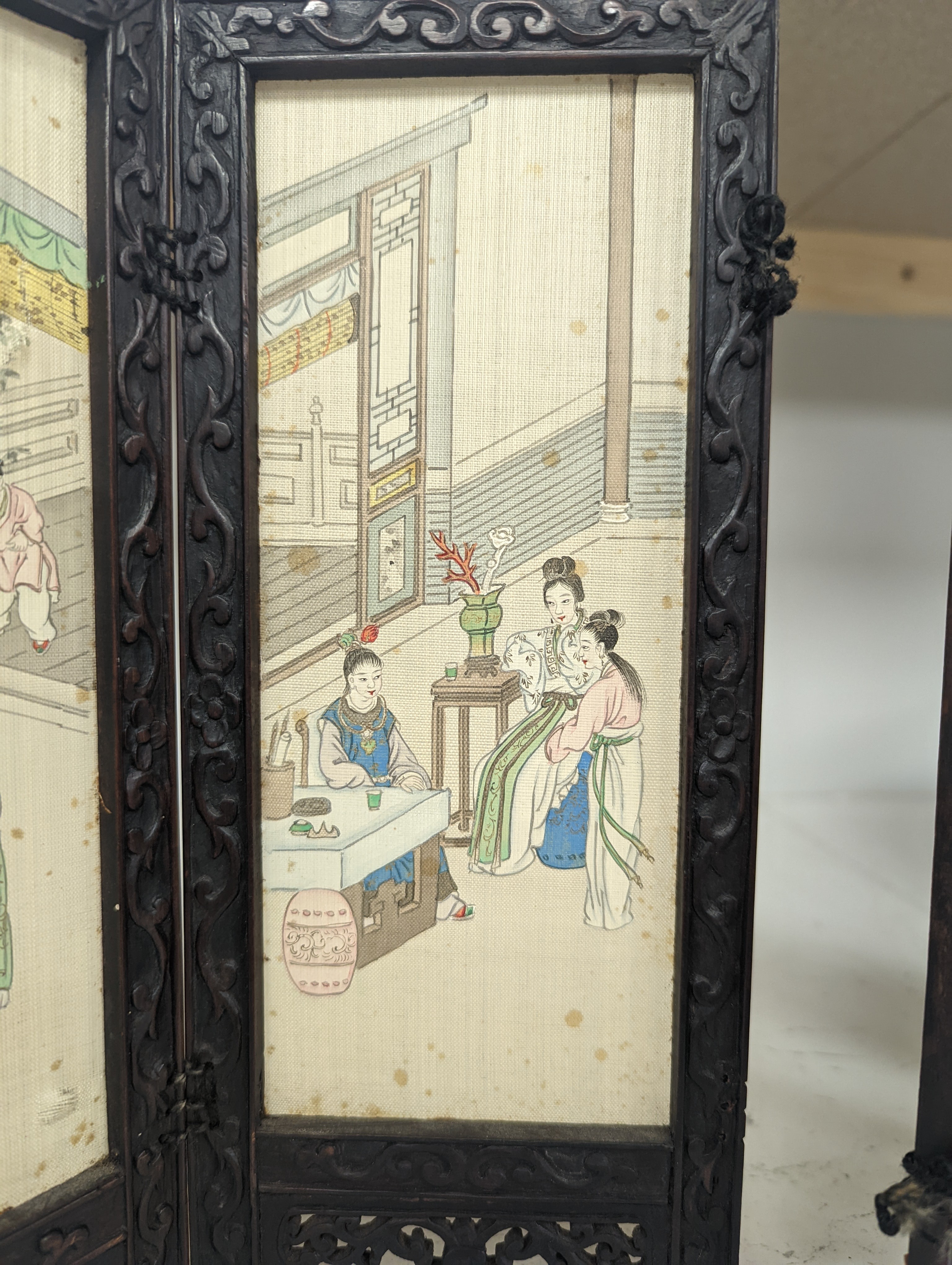 A Chinese hardwood framed painted silk four fold miniature screen, inset with painted silk panels, 28cm